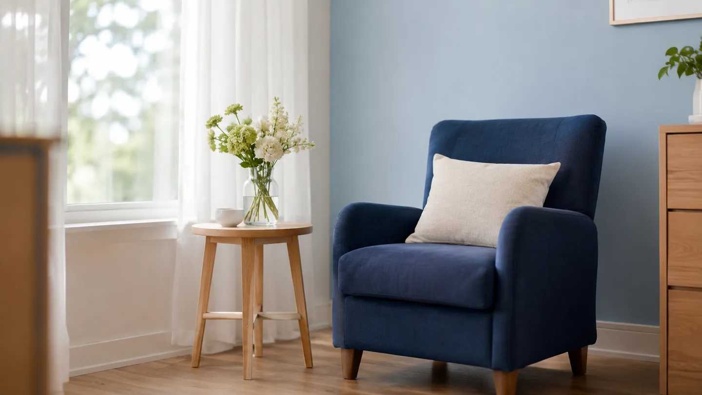 A quiet consultation corner with an upholstered chair and fresh flowers