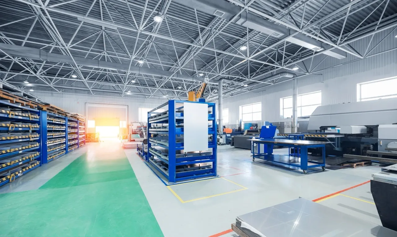 Industrial facility floor with equipment racks and machinery